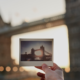 Blurred bridge in background with polaroid of same bridge in foreground