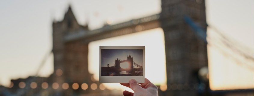 Blurred bridge in background with polaroid of same bridge in foreground
